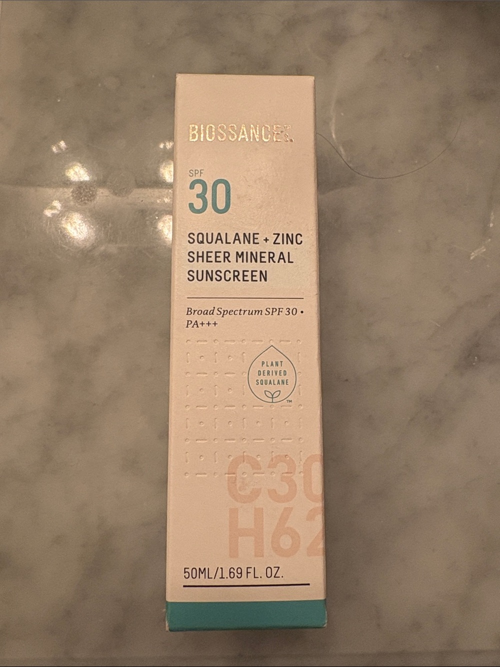 Biossance Squalane + Zinc Sheer Mineral Sunscreen — Teal, White, Cream